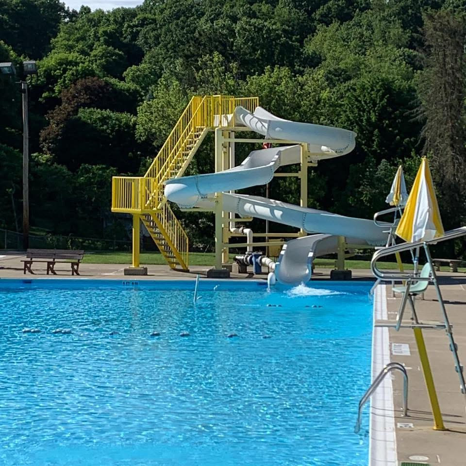 Kids splashing down the big water slide